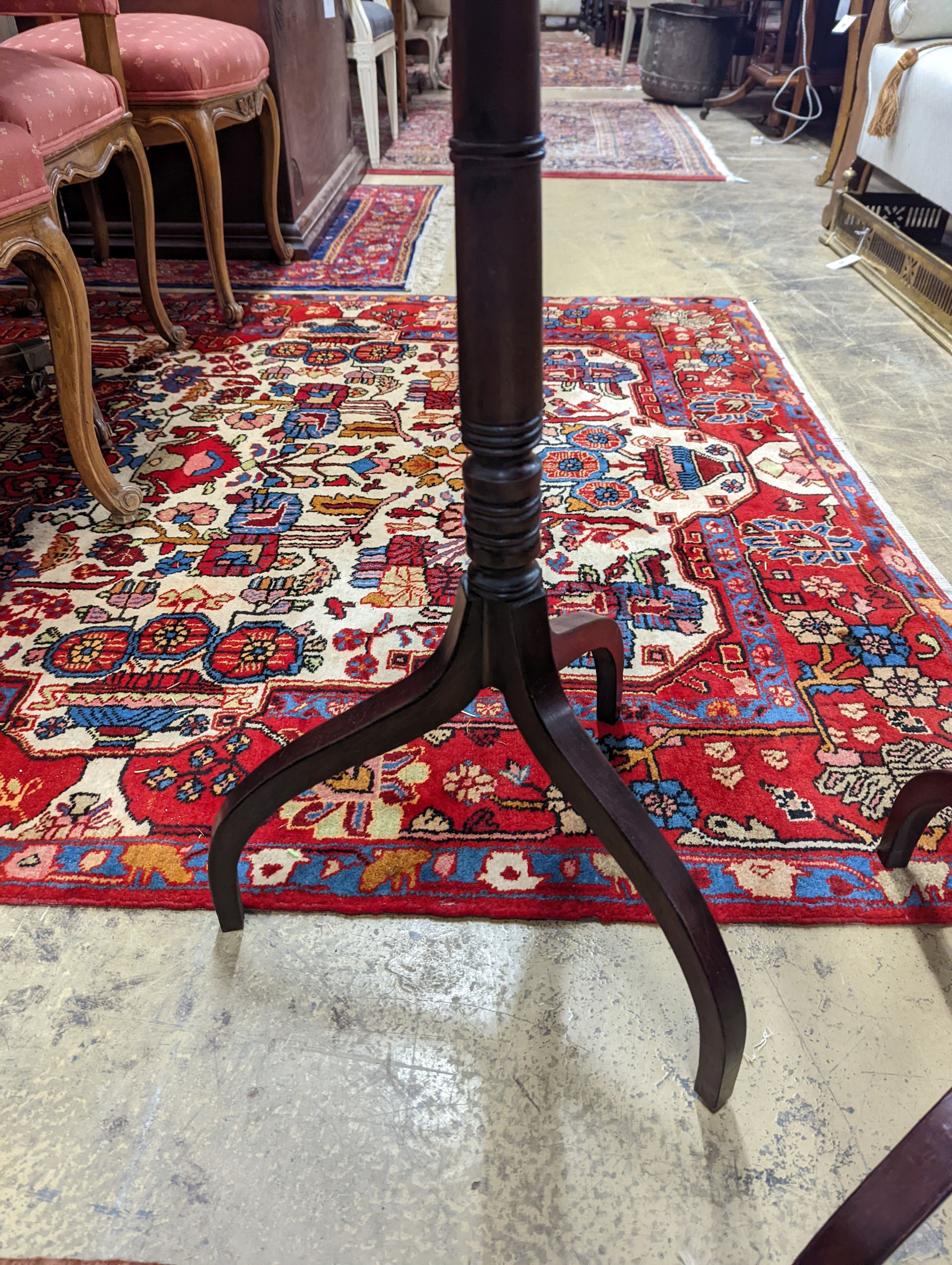 A pair of Regency style mahogany octagonal tripod wine tables, width 38cm, height 77cm